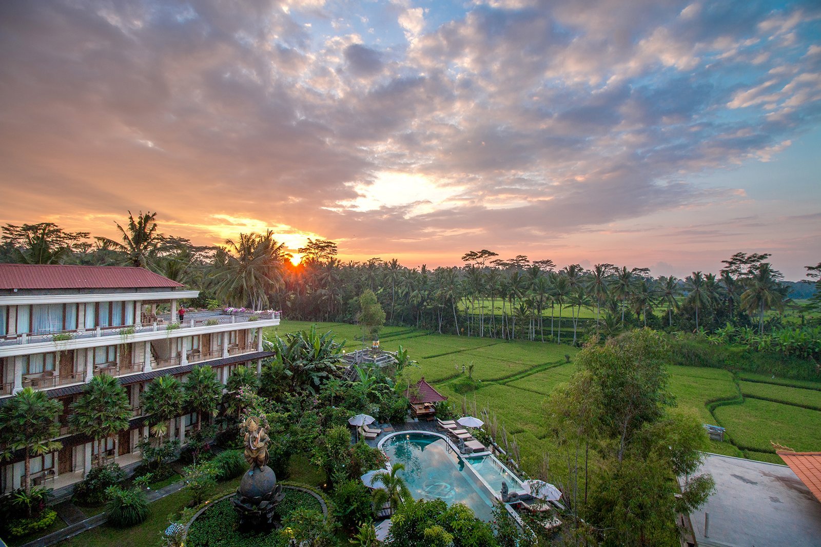 Sunrise over the yoga retreat accommodation in Ubud, Bali, surrounded by rice fields